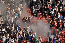 Smoke rises in the GC sector during the Super League football match between Grasshoppers and FC Zurich, on Sunday, October 2, 2011 at the Letzigrund Stadium in Zurich. The match was suspended after the 77th minute. Smoke rises in the GC sector during the Super League football match between Grasshoppers and FC Zurich, on Sunday, October 2, 2011 at the Letzigrund Stadium in Zurich. The match was suspended after the 77th minute.