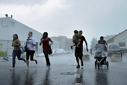 People are fleeing towards a safe place. People are fleeing towards a safe place.