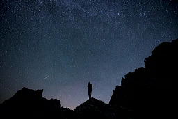 Stars and shooting stars illuminate the night sky above the Drusenfluh (2,827 meters), left, and Sulzfluh (2,817 meters), during the annual Perseid meteor shower, photographed on Thursday, August 13, 2015, in St. Antoenien. (KEYSTONE/Gian Ehrenzeller)