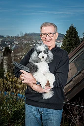 Retired police officer Nöldi Gmür (63) with his poodle Harley