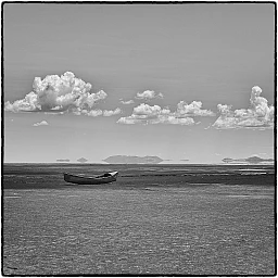 We continue by foot walking straight toward the distant silhouette of a fishing boat, floating on the edge between lake earth and sky. Oruro Bolivia We continue by foot walking straight toward the distant silhouette of a fishing boat, floating on the edge between lake earth and sky. Oruro Bolivia