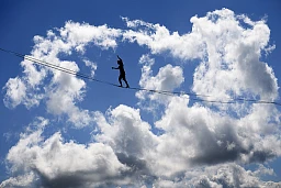 Swiss Samuel Volery, professional mountaineer, walks on the 585 meter line during the Highline Extreme event on the top of the Moleson peak at 2000 meters above the sea level, in the Swiss Alps, near Fribourg, Switzerland, Thursday, September 8, 2016. 25 of the European best slackliners compete until September 11, on 8 different lines ranging from 45 metres to 495 metres. Balancing on the "slackline" is a training method for climbers to improve their equilibrium sense. To avoid the danger of falling down, the athlete is secured with a rope. (KEYSTONE/Laurent Gillieron).. Swiss Samuel Volery, professional mountaineer, walks on the 585 meter line during the Highline Extreme event on the top of the Moleson peak at 2000 meters above the sea level, in the Swiss Alps, near Fribourg, Switzerland, Thursday, September 8, 2016. 25 of the European best slackliners compete until September 11, on 8 different lines ranging from 45 metres to 495 metres. Balancing on the "slackline" is a training method for climbers to improve their equilibrium sense. To avoid the danger of falling down, the athlete is secured with a rope. (KEYSTONE/Laurent Gillieron)..
