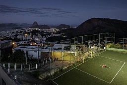 Francischelio Gomez Silva, who's got "Helio" nickname, football goalkeeper, 25 years old, on his community football field. He's always dreamed about to be a professional goalkeeper one day. Favela "Morro dos Prazeres", Rio de Janeiro, Brazil, July 2014. Francischelio Gomez Silva, who's got "Helio" nickname, football goalkeeper, 25 years old, on his community football field. He's always dreamed about to be a professional goalkeeper one day. Favela "Morro dos Prazeres", Rio de Janeiro, Brazil, July 2014.