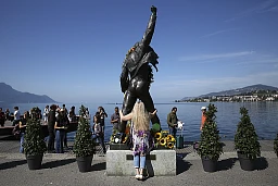 A fan poses behind a statue of the British band Queen's late singer Freddie Mercury on September 8, 2018 in Montreux. - Queen fans gather every year in Montreux to celebrate Freddie Mercury's birthday. Queen recored several albums in this city and the fifteenth and final studio album 'Made in Heaven' was completed at the band's 'Mountain Studio'. A biopic about the British rock band entitled 'Bohemian Rhapsody' is due to be released in the United Kingdom on October 24, 2018. A fan poses behind a statue of the British band Queen's late singer Freddie Mercury on September 8, 2018 in Montreux. - Queen fans gather every year in Montreux to celebrate Freddie Mercury's birthday. Queen recored several albums in this city and the fifteenth and final studio album 'Made in Heaven' was completed at the band's 'Mountain Studio'. A biopic about the British rock band entitled 'Bohemian Rhapsody' is due to be released in the United Kingdom on October 24, 2018.