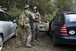 Two Airsoft players pictured prior a seven hour non-stop operation with involving classic games styles; domination, capture the flag, and search and destroy, this Sunday, September 16, 2018 near Bex, Switzerland. Airsoft is a competitive team shooting sport in which participants shoot opponents with spherical plastic projectiles launched via replica weapons called airsoft guns. (KEYSTONE/Anthony Anex)