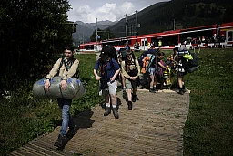 Young scouts arrive at the train station of Ulrichen next to the campground on the first day of the Federal Scout Camp, mova, this Saturday, July 23, 2022 in the Goms Valley in Ulrichen. The biggest scout camp ever will take place in the Goms Valley from July 23 to August 6, 2022. This unique event, which takes place every 14 years, gathers about 30'000 scouts from all over Switzerland during two weeks. (KEYSTONE/Gabriel Monnet)