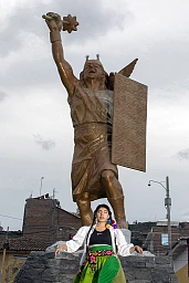 Renata stands before a Wari warrior statue in Ayacucho. The Wari were an ancient Peruvian civilization from AD 600 to AD 1100.22 yers old Renata Flores, a famous social media figure in Peru, gained recognition for her Quechua cover of Michael Jackson's song "The way you make me feel". She has become a spokesperson for the Quechua language, instilling pride in young people for their indigenous roots. Renata's fame has led her to be listed among the fifty most influential women in Peru by Forbes magazine. Born in Ayacucho, a city with a painful history of violence, Renata is navigating her newfound fame with difficulty. Despite the challenges, she remains committed to promoting Quechua and preserving the indigenous culture. Renata's journey of rediscovery started in her childhood home, where she learned about the power of herbs and the beauty of the Quechua language from her grandmother. Renata's music combines Andean rhythms and instruments with rap, addressing themes of empowerment and social justice. She is determined to make Quechua a globally recognized language that unifies rather than divides. Renata stands before a Wari warrior statue in Ayacucho. The Wari were an ancient Peruvian civilization from AD 600 to AD 1100.22 yers old Renata Flores, a famous social media figure in Peru, gained recognition for her Quechua cover of Michael Jackson's song "The way you make me feel". She has become a spokesperson for the Quechua language, instilling pride in young people for their indigenous roots. Renata's fame has led her to be listed among the fifty most influential women in Peru by Forbes magazine. Born in Ayacucho, a city with a painful history of violence, Renata is navigating her newfound fame with difficulty. Despite the challenges, she remains committed to promoting Quechua and preserving the indigenous culture. Renata's journey of rediscovery started in her childhood home, where she learned about the power of herbs and the beauty of the Quechua language from her grandmother. Renata's music combines Andean rhythms and instruments with rap, addressing themes of empowerment and social justice. She is determined to make Quechua a globally recognized language that unifies rather than divides.