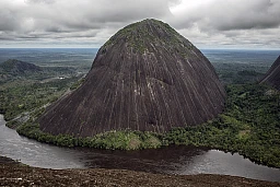On the banks of the Inírida river, the rocky hills of Mavicure ("mavi": tip of the blowpipe, and "cure" the poison applied to the dart), are composed of Pajarito (712 metres), Mono (480 metres) and Mavicure (170 metres). The three of them are sacred to the indigenous ethic groups of the Kurripaco, Puinave and Tukano that inhabit the area. In the picture we can see the Mono hill. On the banks of the Inírida river, the rocky hills of Mavicure ("mavi": tip of the blowpipe, and "cure" the poison applied to the dart), are composed of Pajarito (712 metres), Mono (480 metres) and Mavicure (170 metres). The three of them are sacred to the indigenous ethic groups of the Kurripaco, Puinave and Tukano that inhabit the area. In the picture we can see the Mono hill.