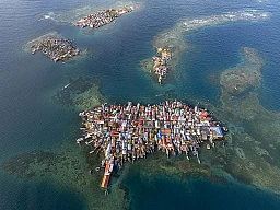 Aerial shot of Gardi Sugdub, or ‘Crab Island,’ is a tiny island in an archipelago off Panama’s northern Caribbean coast and has been home to Guna Indigenous people for over 100 years. Originally the island provided the Guna with refuge from mainland mosquito-borne illnesses and colonial restrictions, but today, Gardi Sugdub faces new challenges. With nearly 1,300 people on an island of about five soccer fields, there is no room to expand homes or for children to play. Aerial shot of Gardi Sugdub, or ‘Crab Island,’ is a tiny island in an archipelago off Panama’s northern Caribbean coast and has been home to Guna Indigenous people for over 100 years. Originally the island provided the Guna with refuge from mainland mosquito-borne illnesses and colonial restrictions, but today, Gardi Sugdub faces new challenges. With nearly 1,300 people on an island of about five soccer fields, there is no room to expand homes or for children to play.
