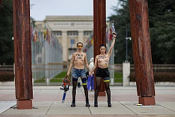 FEMEN members protest under the « Broken Chair" Monument, at Place des Nations, one of them with a chainsaw, outside the European headquarters of the UN in Geneva, Switzerland, December 13, 2024. REUTERS/Pierre Albouy FEMEN members protest under the « Broken Chair" Monument, at Place des Nations, one of them with a chainsaw, outside the European headquarters of the UN in Geneva, Switzerland, December 13, 2024. REUTERS/Pierre Albouy
